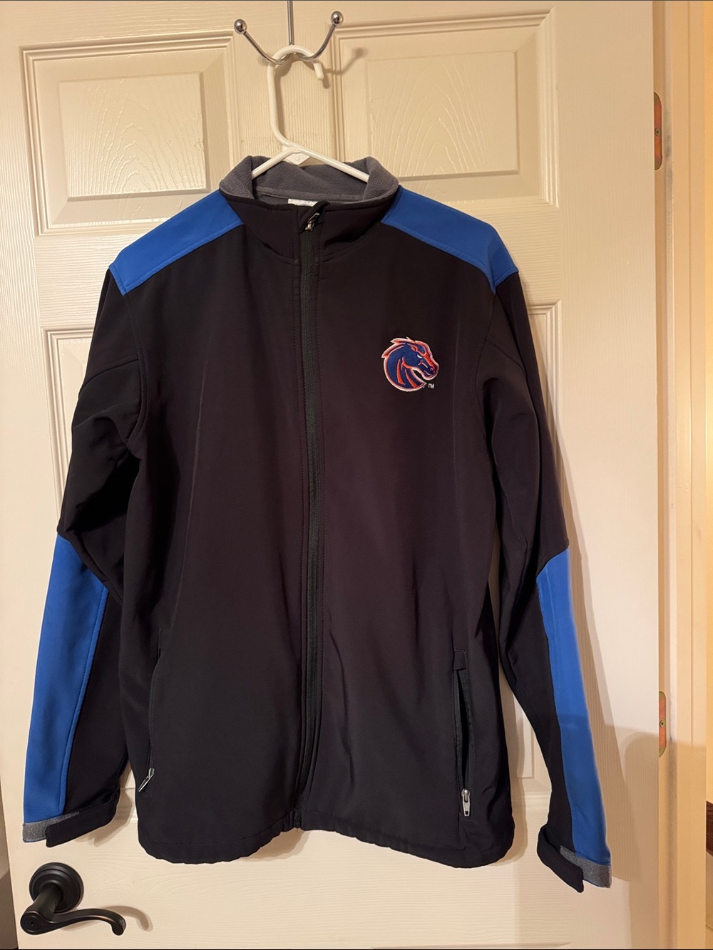 Rivalry Threads Black Jacket with Blue Accents and Team Crest